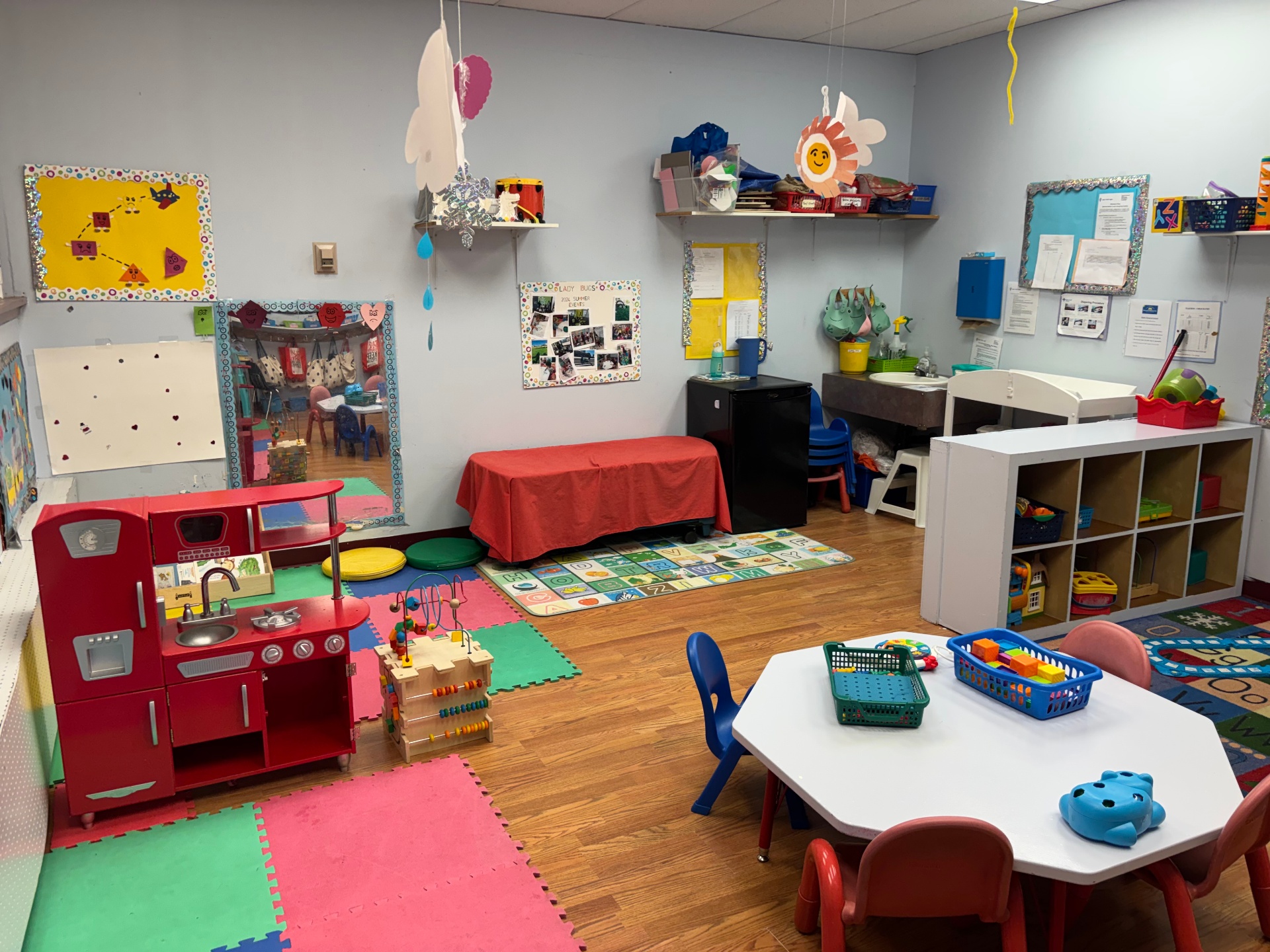 The play kitchen corner and foam mat floor