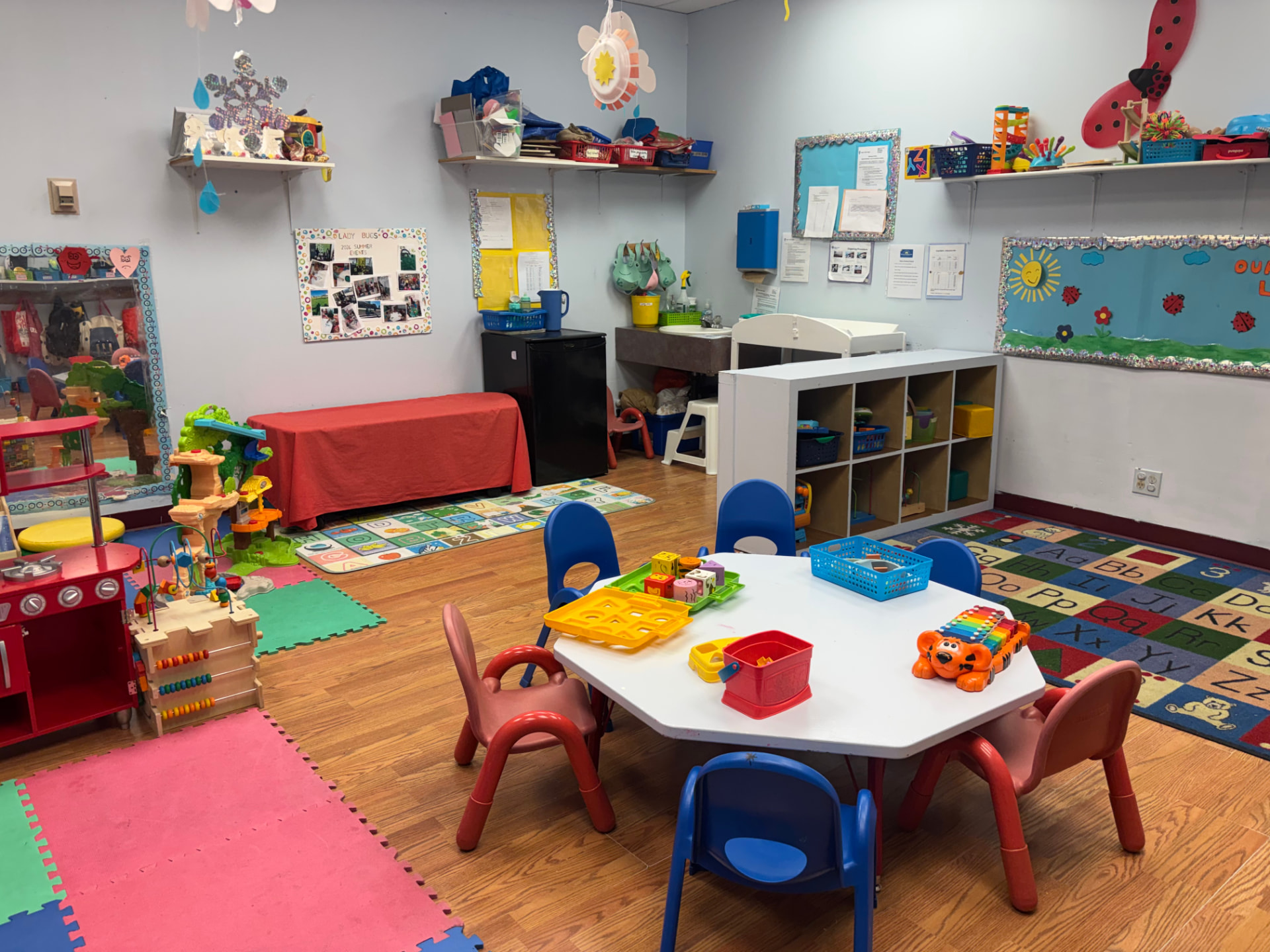 The Lady Bugs room, octagon table and alphabet rug
